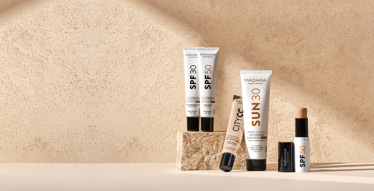 Line-up of MÁDARA tinted mineral sunscreen formulas, including SPF30, SPF50, SUN30, City CC Cream and a tinted mineral sunscreen stick SPF50