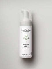 Mádara Purifying Foam bottle on a light gray background