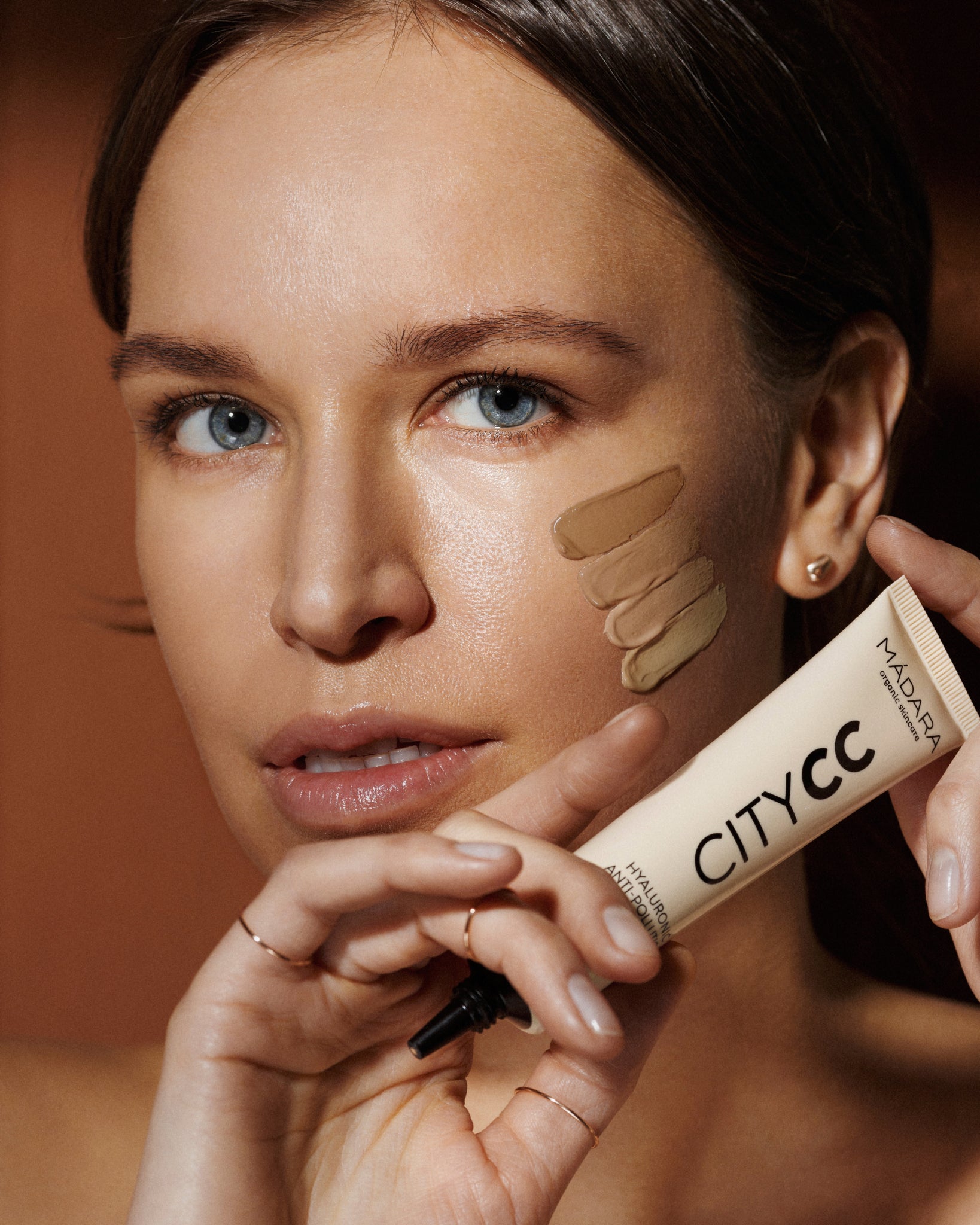 MÁDARA Organic Skincare spf 15 tinted cc cream tan A3413 mineral sunscreen product photo on plain background.