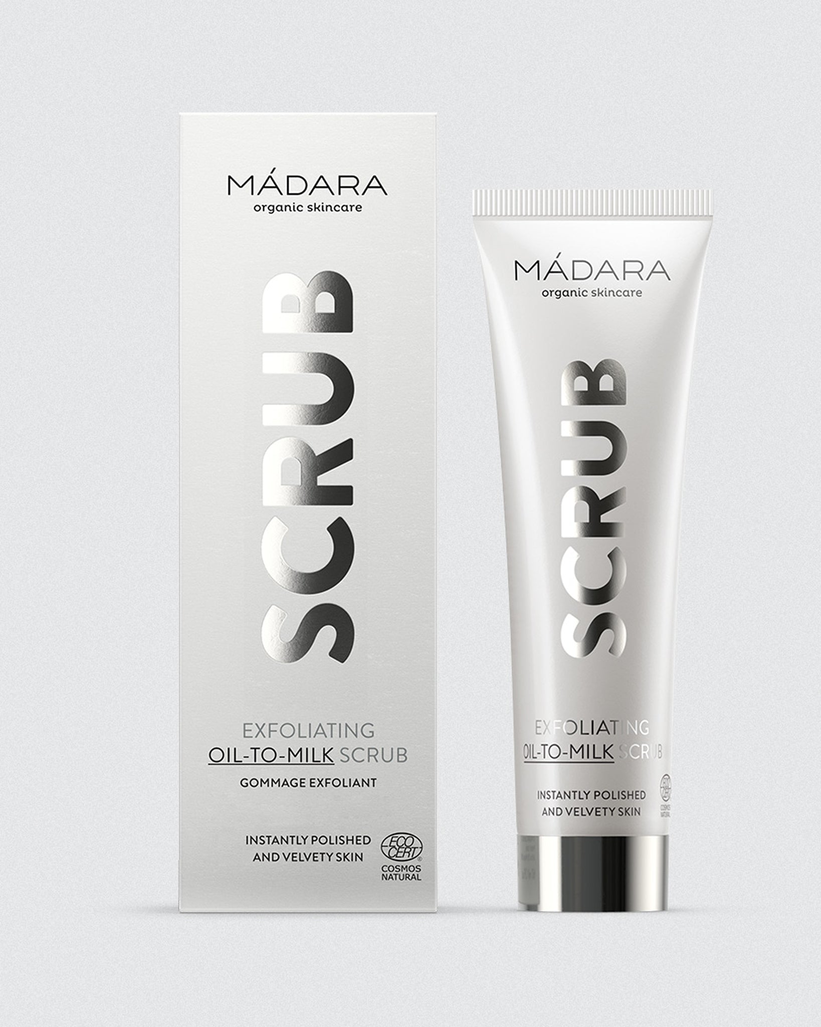 Model wearing MÁDARA Organic Skincare face scrub madara A2151 on skin; close-up portrait shows natural application results.