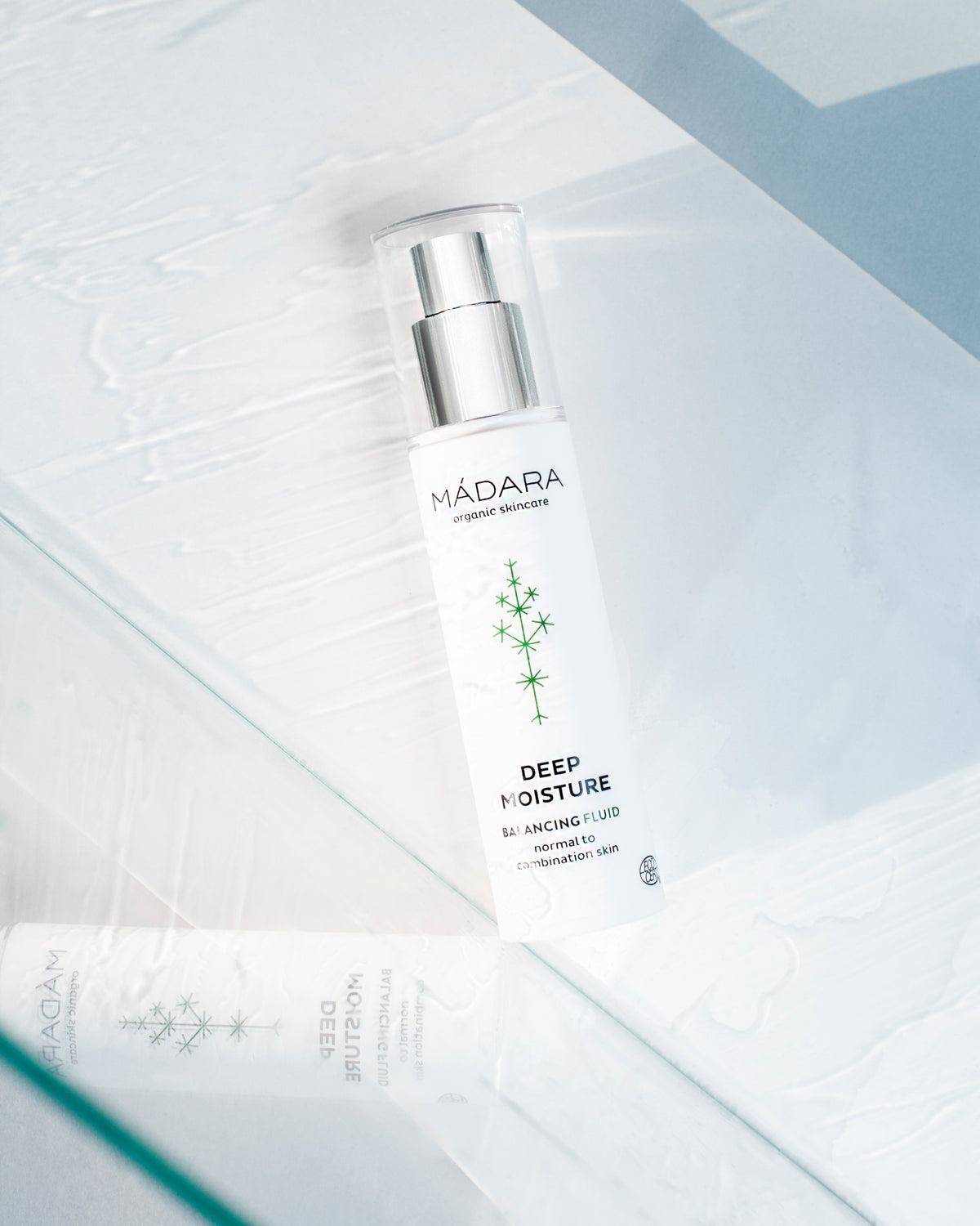 MÁDARA Organic Skincare balancing fluid A2211 product photo on plain background.
