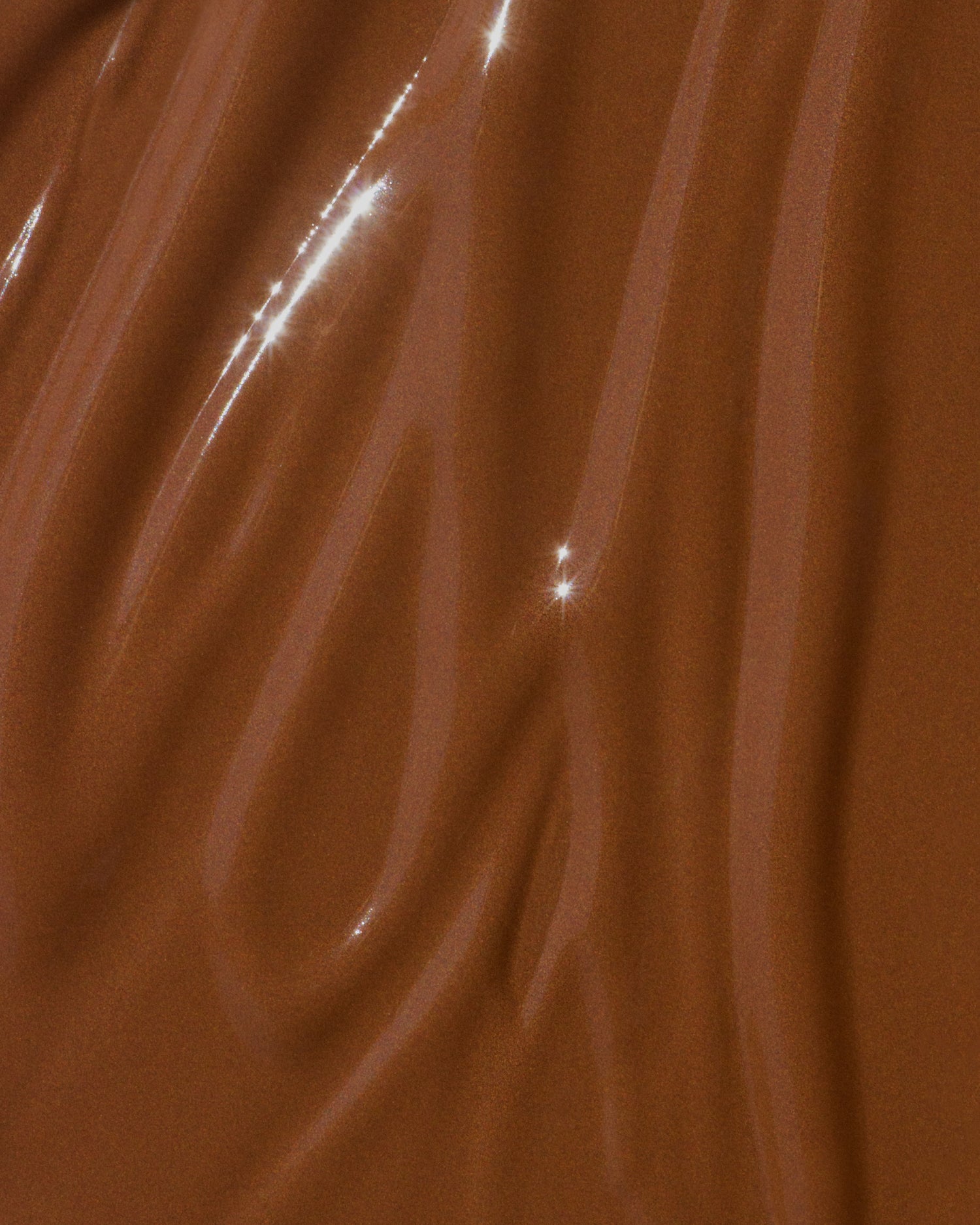Texture close-up of MÁDARA Organic Skincare skin equal chestnut A6067 �swatch demonstrates consistency and finish.