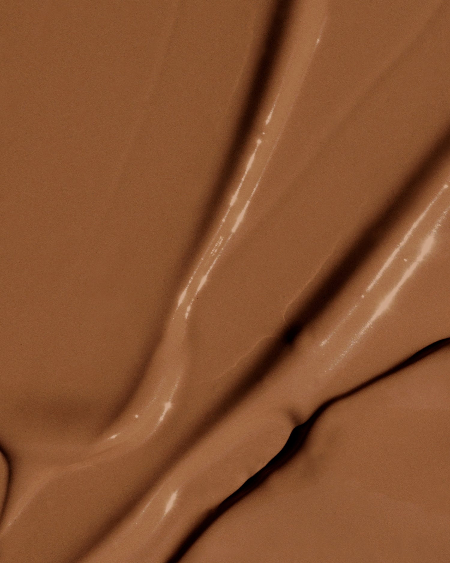 Texture close-up of MÁDARA Organic Skincare the concealer rich soil A6116 concealer �swatch demonstrates consistency and finish.