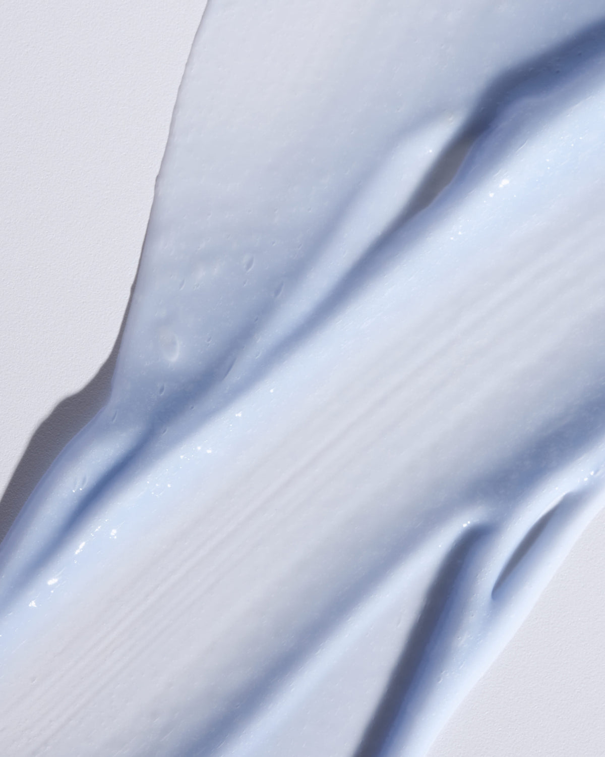 Texture close-up of MÁDARA Organic Skincare retinol alternative complex A3185 �swatch demonstrates consistency and finish.
