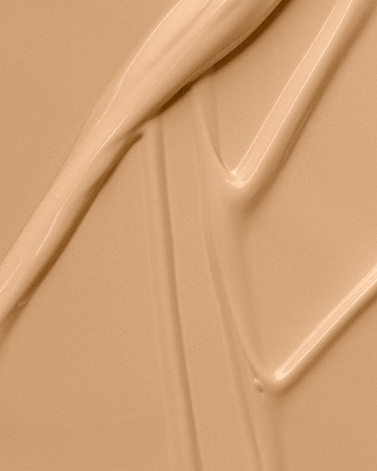 Texture close-up of MÁDARA Organic Skincare skinonym sand A6085 �swatch demonstrates consistency and finish.