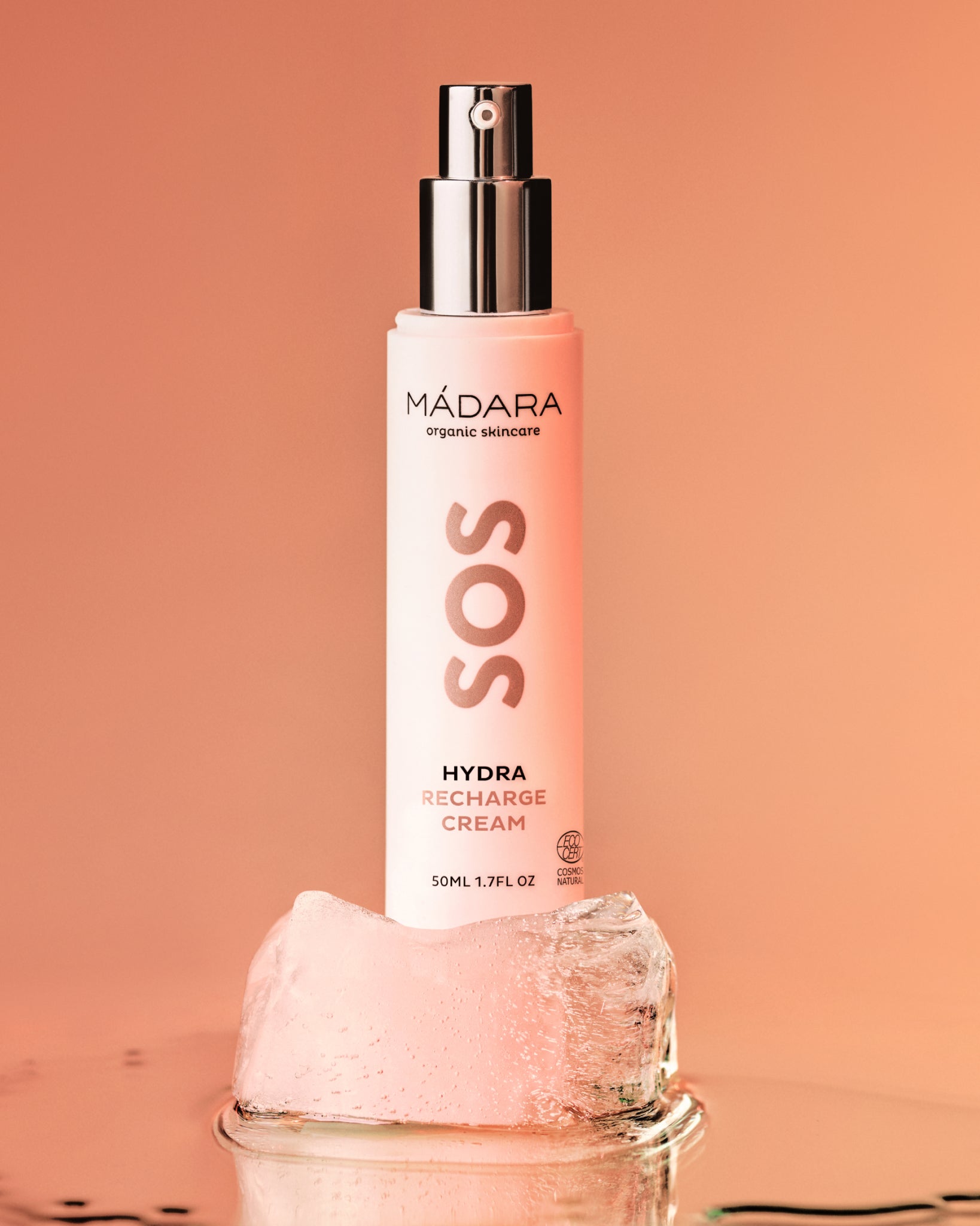 Mádara SOS Hydra Recharge Organic Face Cream bottle on a peach background