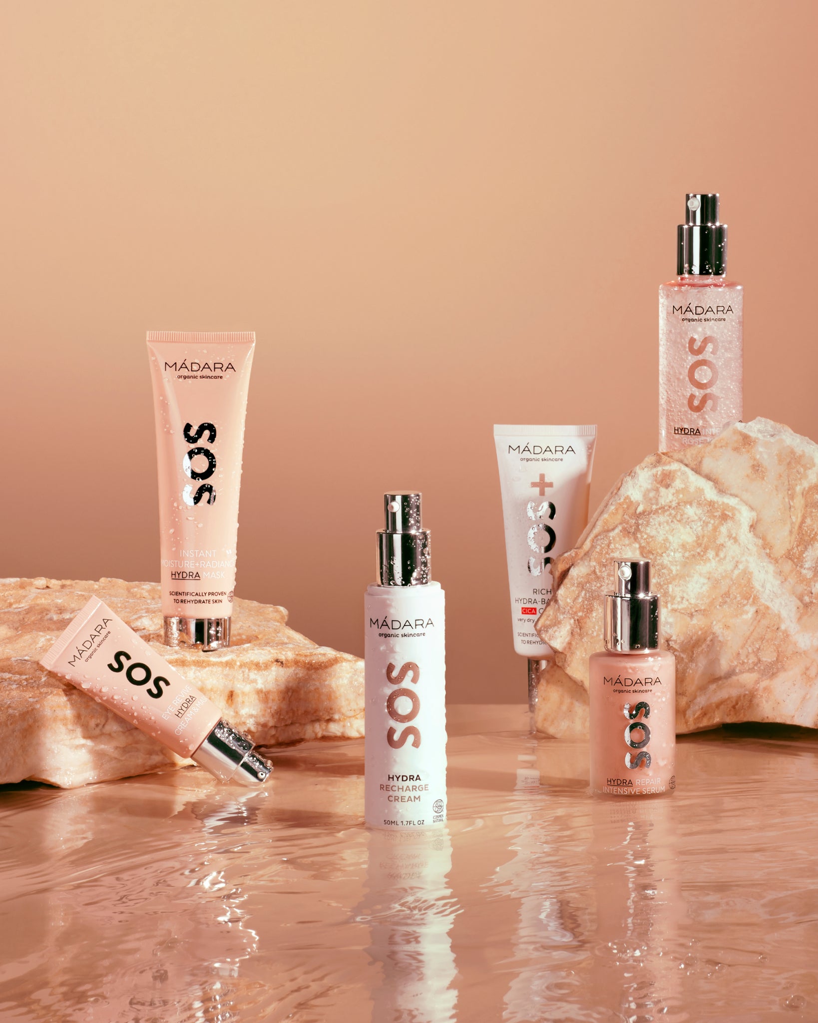 Collection of Madara SOS skincare line products on a beige background