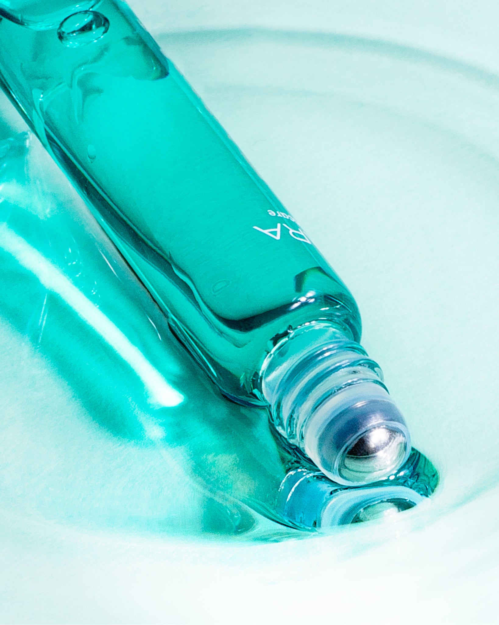 MÁDARA Organic Skincare acne breakout roll on product photo on plain background.