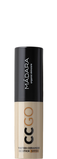 MÁDARA CC Go tinted ceramide SPF30 stick in beige packaging with a black cap