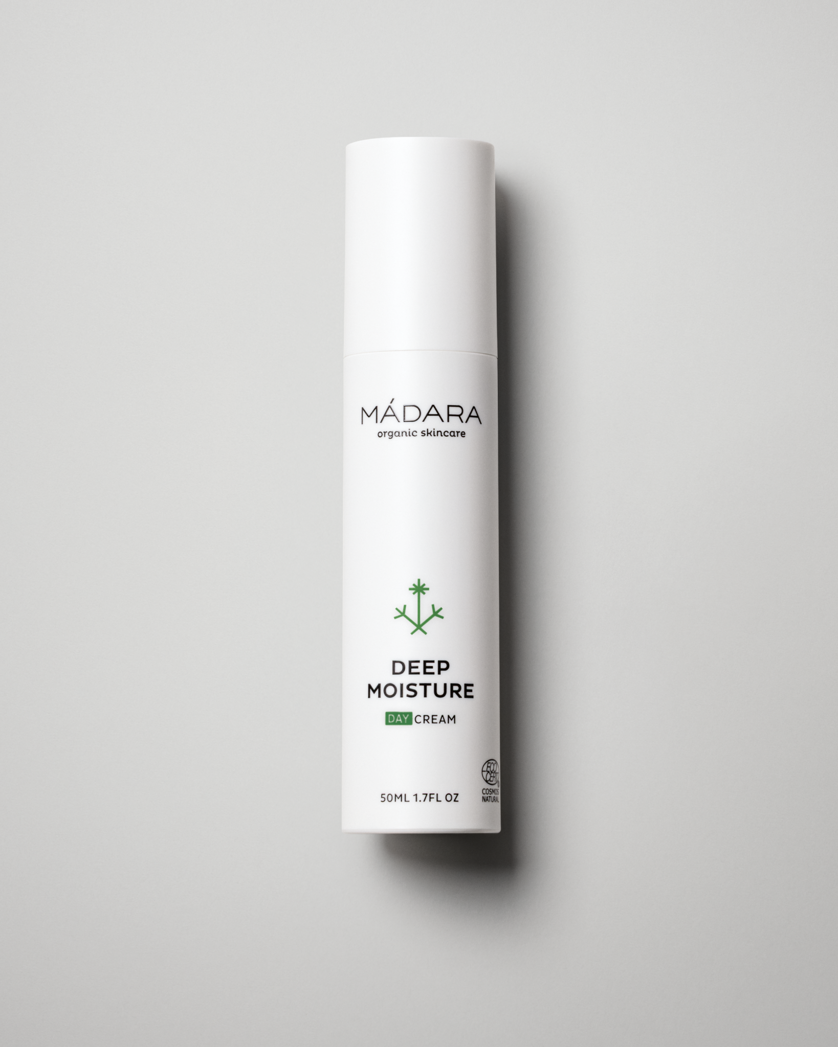 Mádara Deep Moisture cream tube on a gray background